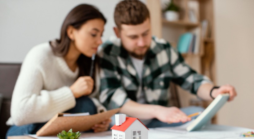 Couple looking over auction finance deal.