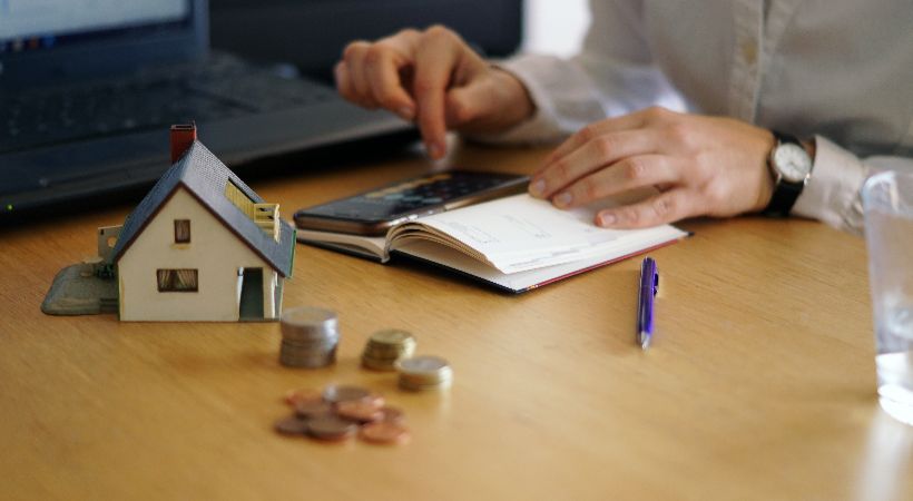 Someone calculating property development finance