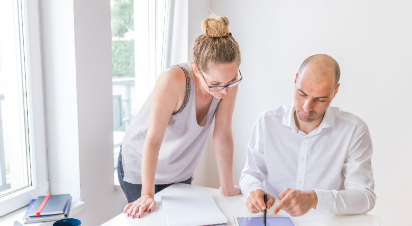 Couple looking at their property ahead of an expansion