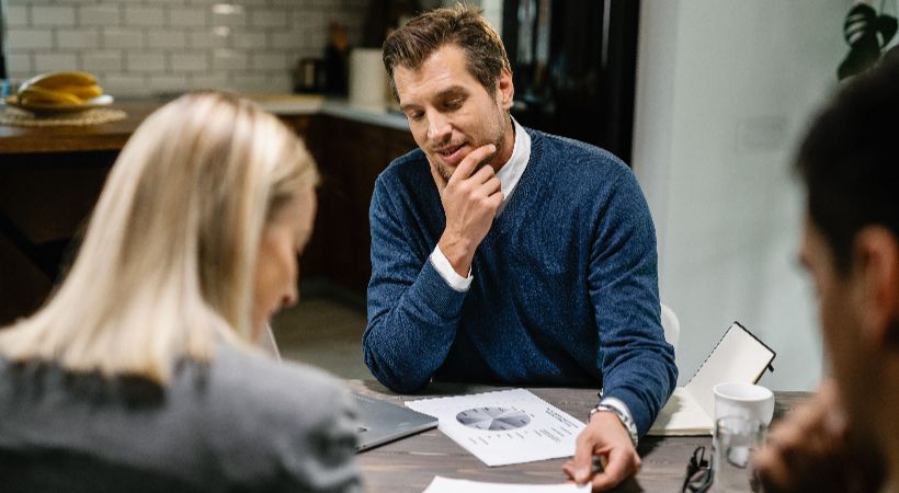 Someone meeting with a financial advisor 