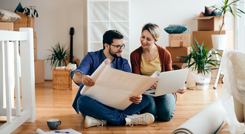 Couple working out finances for a property development